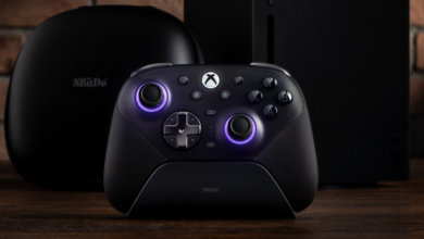 8BitDo Ultimate Controller on charging dock with Xbox console and case.