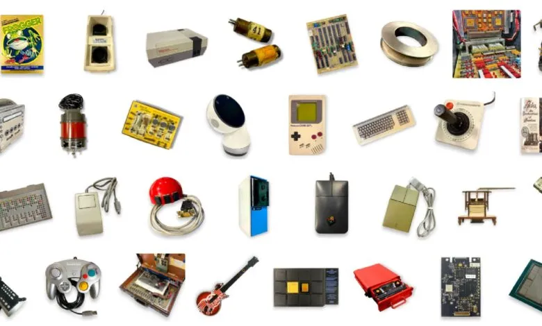 Collection of vintage electronics and computer components on a white background.