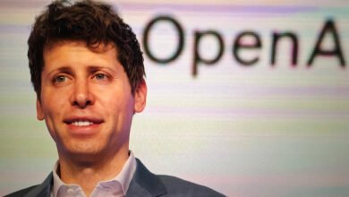 Close-up of Sam Altman, CEO of OpenAI, smiling slightly.