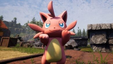 Pink Pokémon character with blue eyes stands in outdoor setting.