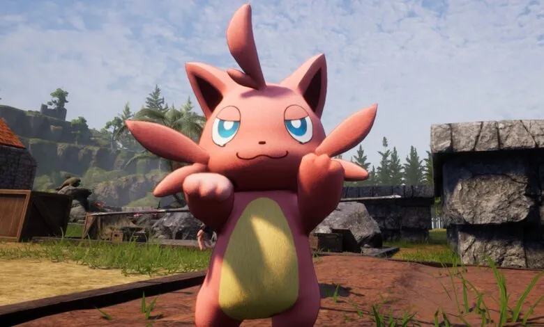 Pink Pokémon character with blue eyes stands in outdoor setting.