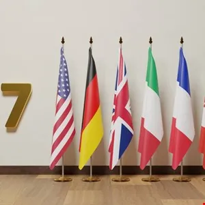 Flags of G7 nations: USA, Germany, UK, Italy, France, Canada, and Japan.
