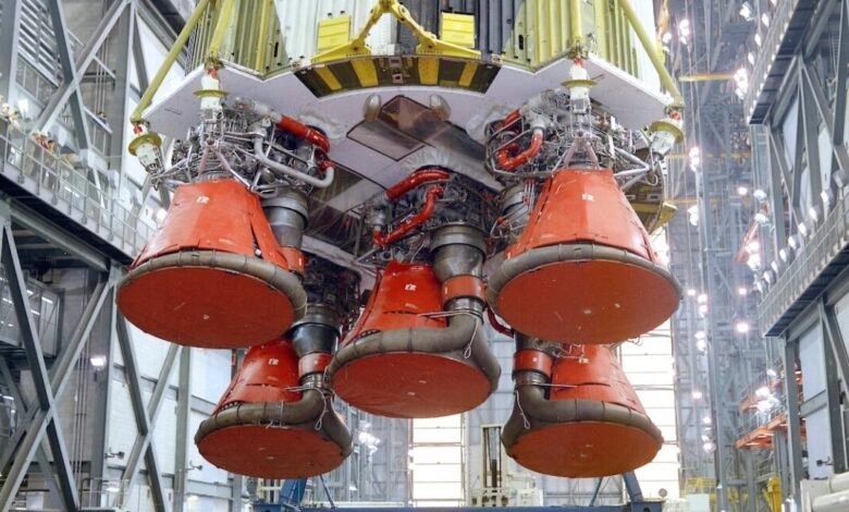 Close-up of Apollo Saturn V S-IC stage engines, red nozzles visible.