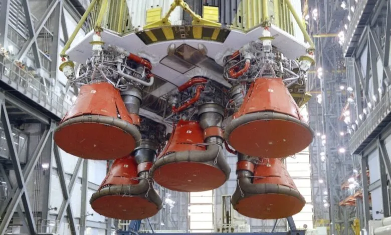 Close-up of Apollo Saturn V S-IC stage engines, red nozzles visible.