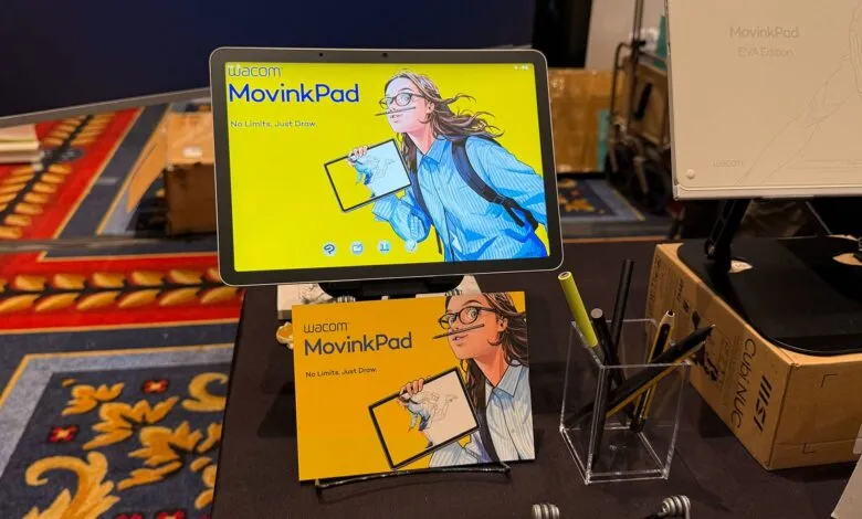 Wacom MovinkPad display showing an illustration of a young woman drawing.