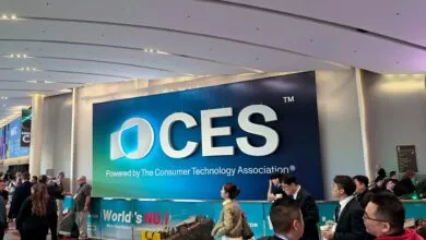 CES trade show entrance with large logo and attendees.
