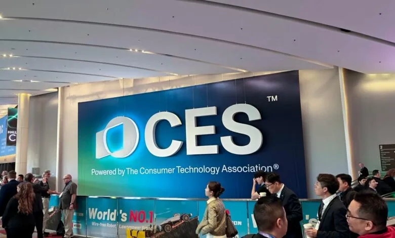 CES trade show entrance with large logo and attendees.