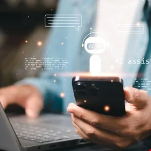 Person using phone with AI assistant graphic overlay, laptop visible.