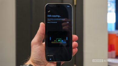 Android phone displaying 'Still copying...' during data transfer process.