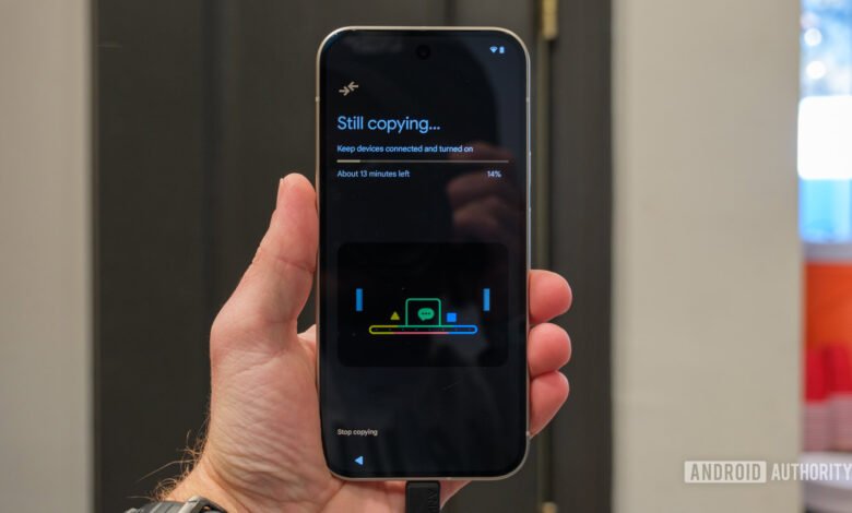 Android phone displaying 'Still copying...' during data transfer process.