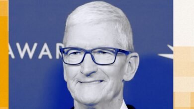 Close-up of Tim Cook, Apple CEO, wearing glasses and smiling.