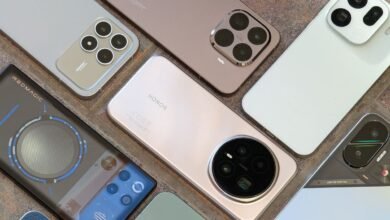 Several smartphones arranged to showcase their rear camera designs.