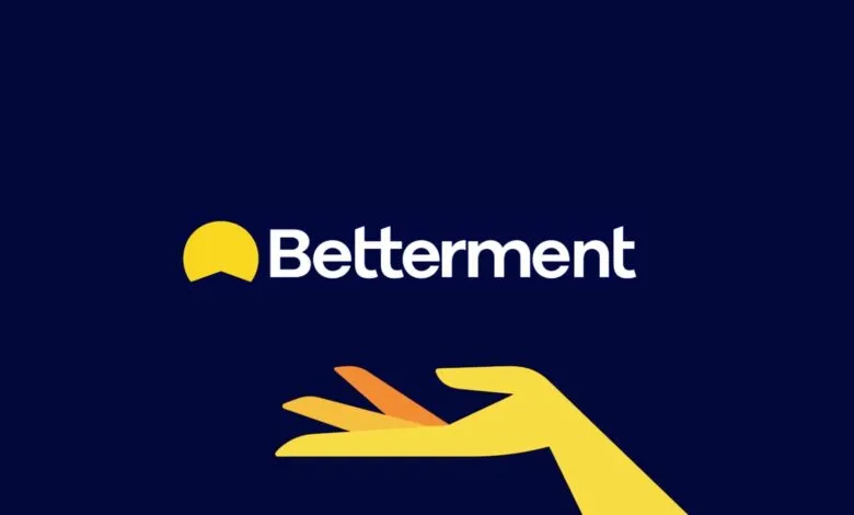 Betterment logo with stylized hand on dark blue background.