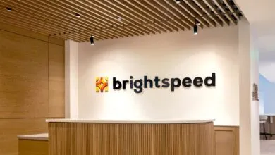 Brightspeed logo displayed in a modern office reception area.