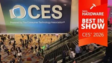 Crowd of people at CES 2026, Tom's Hardware Best in Show award displayed.
