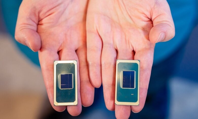 Two hands holding up two computer processor chips.