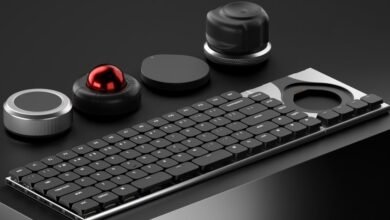 Modular keyboard with trackball, dials, and customizable components.