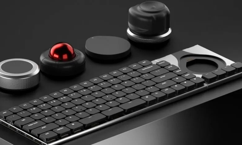 Modular keyboard with trackball, dials, and customizable components.
