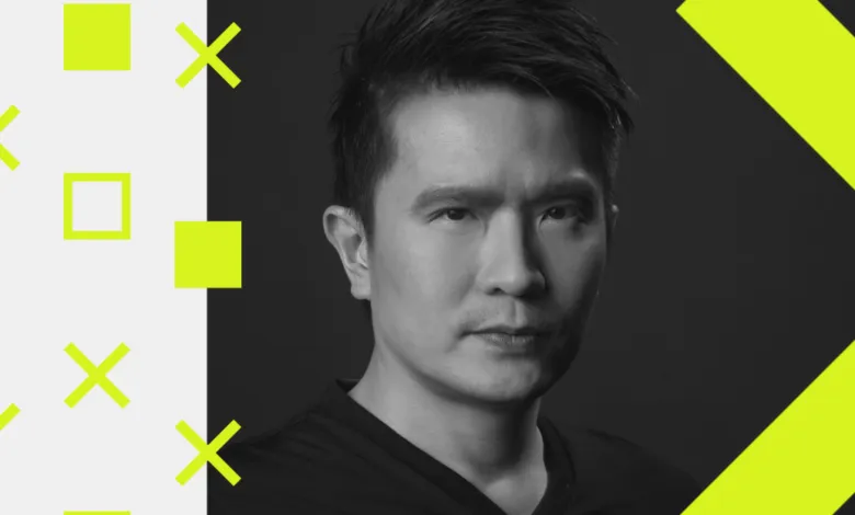 Portrait of Min-Liang Tan, CEO of Razer, in black and white.