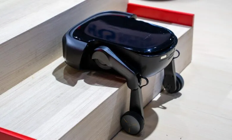 Roborock robot vacuum cleaner climbing stairs with its robotic legs.