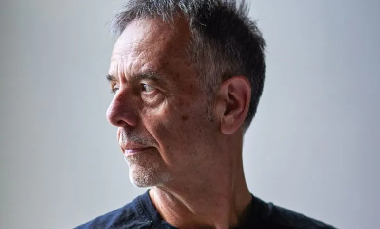 Portrait of Ronald Deibert looking to the left with a thoughtful expression.