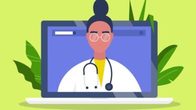 Doctor on laptop screen offering telehealth services.