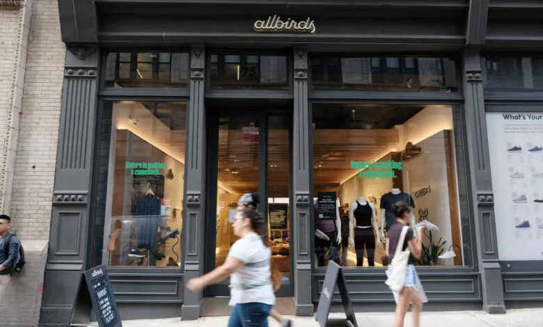 Allbirds store front with people walking by in New York City.