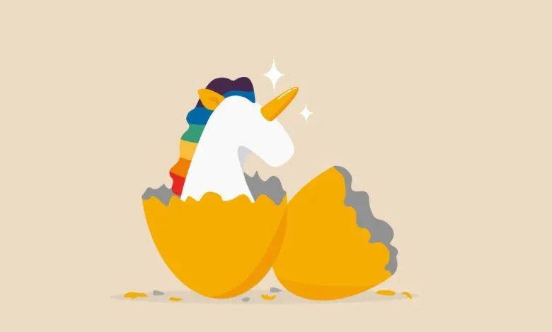 Cartoon unicorn hatching from a golden egg with rainbow mane.
