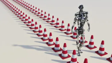 Robot walking a path defined by red and white traffic cones.
