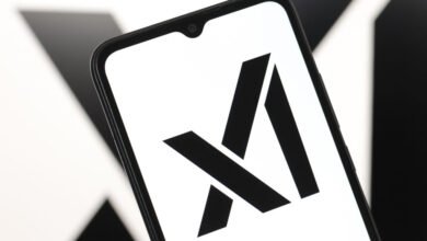 Smartphone displays the xAI logo, a stylized 'X' and 'A' in black on white.