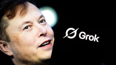 Elon Musk with Grok AI logo displayed on a dark screen.