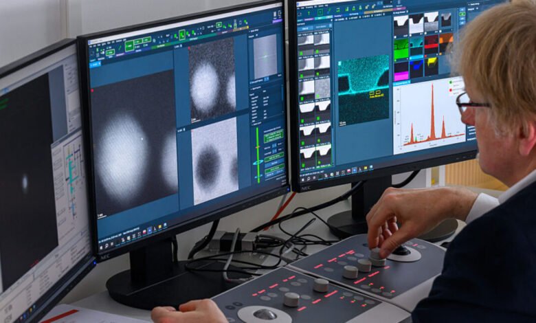 Scientist analyzes microelectronic components on high-performance microscope.