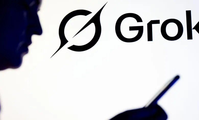 Person using phone with Grok AI logo in background.
