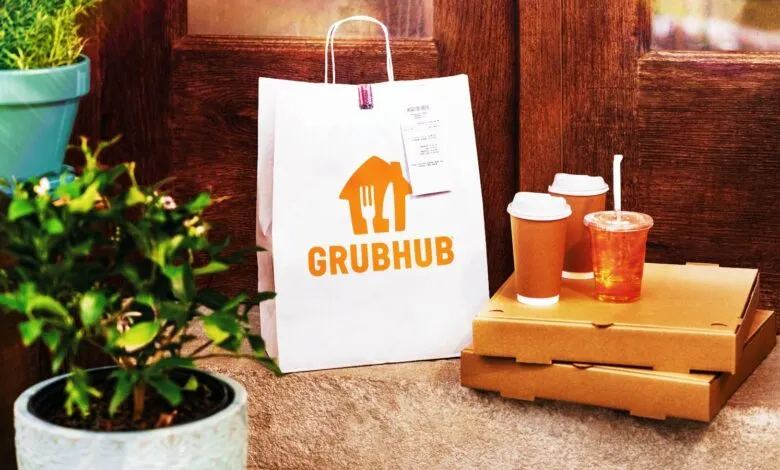 GrubHub delivery bag and food on doorstep.