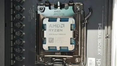 Close-up of an AMD Ryzen 7 9850X3D CPU installed in an AM5 socket.