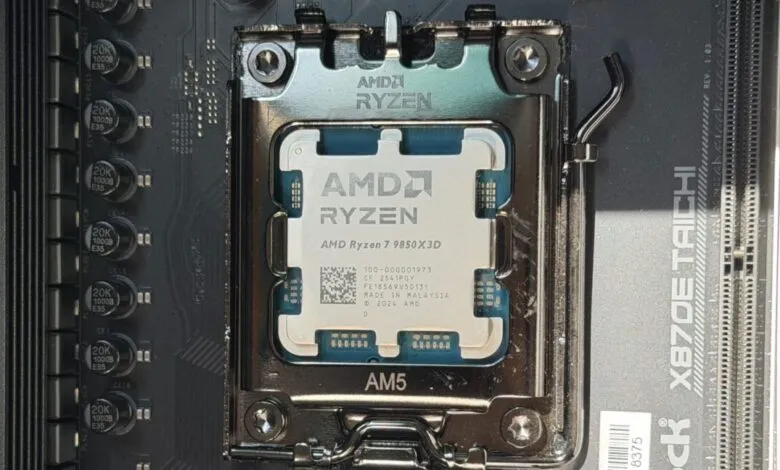 Close-up of an AMD Ryzen 7 9850X3D CPU installed in an AM5 socket.