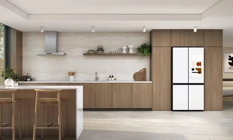Modern kitchen featuring a Samsung Bespoke refrigerator with a digital display.