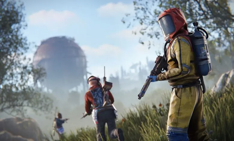 Character in hazmat suit holds gun, with others and large sphere in background.