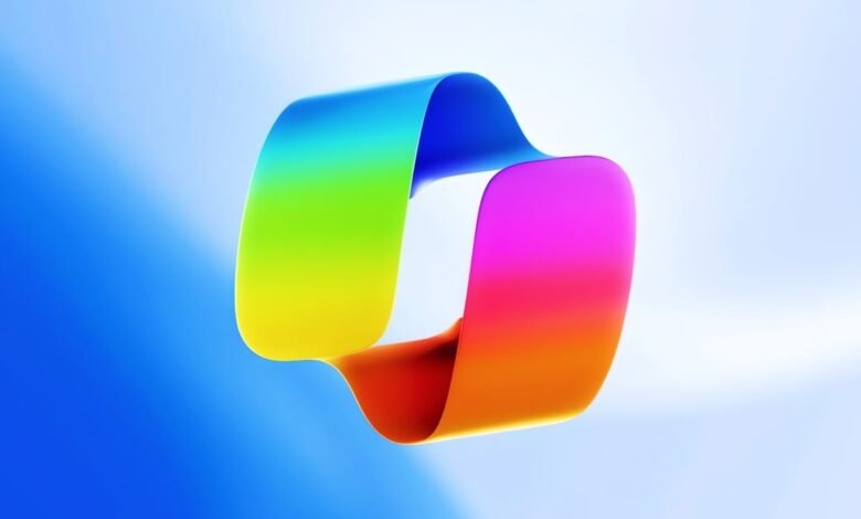Abstract ribbon loop with vibrant rainbow gradient on blue background.