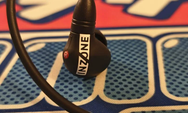 Close-up of Inzone gaming earbuds with 'R' marking on the right earbud.