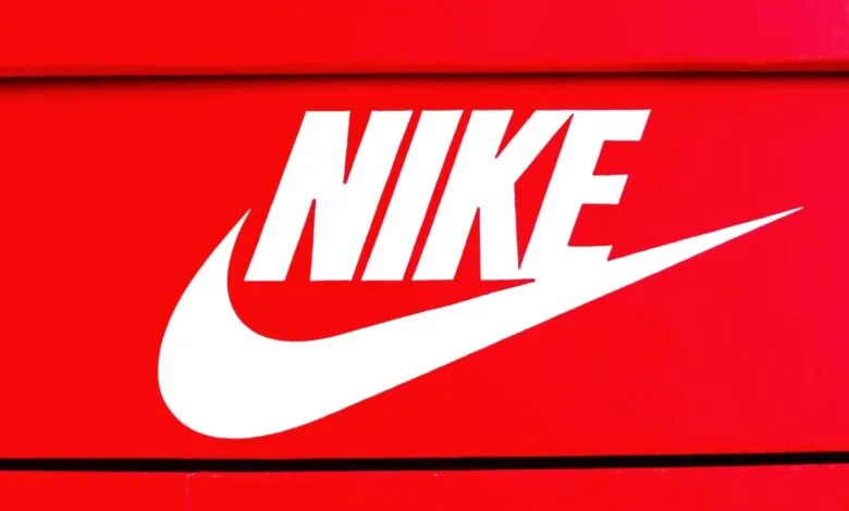 Close-up of the white Nike logo on a red background.