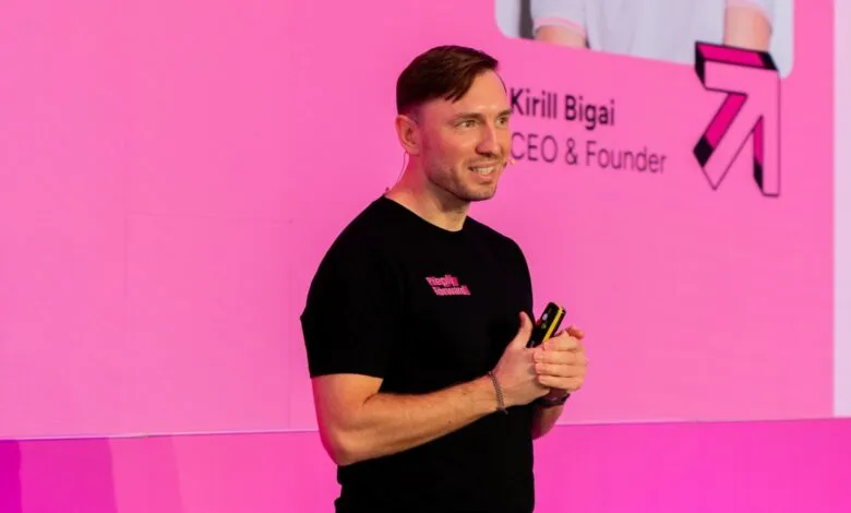 Kirill Bigai, CEO of Preply, presenting on a pink stage.