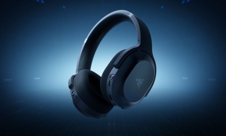 Close-up of black Razer headphones floating against a blue gradient background.