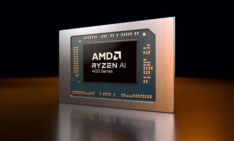 AMD Ryzen AI 400 Series processor chip close-up on reflective surface.