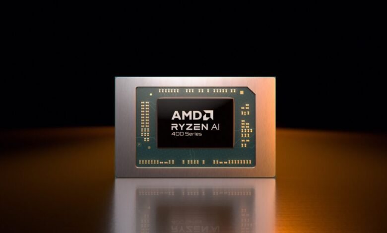 AMD Ryzen AI 400 Series processor chip on reflective surface.