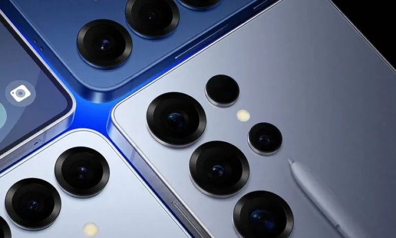 Close-up of three modern smartphones with prominent camera arrays and a stylus.