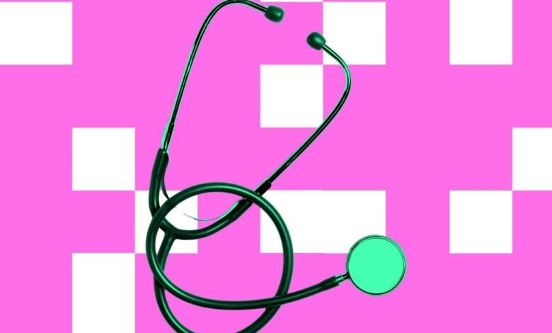 Stethoscope on pink and white checkered background.