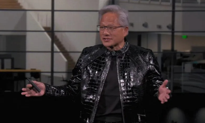 Jensen Huang presents in a black crocodile-patterned jacket.