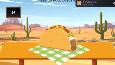 Cartoon taco on a table in the desert with a trophy notification.