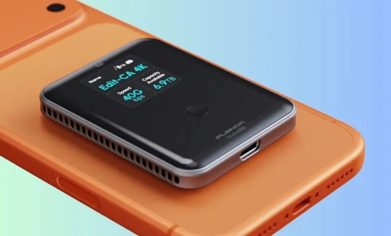 Planck StudioSSD on orange phone showing 6.9TB capacity and 40G bps speed.